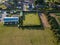 Sutton Suffolk UK July 01 2021: Aerial view of a small village grass bowling green with a game of evening bowls taking place