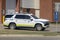 A SUV 911 ambulance parked at the police station