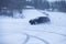 SUV car drifting in snow, during competition, sport car racing drift on snowy race track in winter