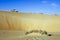 An SUV car on top of a sand dune in Rub Al Khali desert