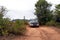 SUV driving on dirt road