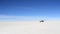 SUV driving on the Salar de Uyuni