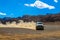 SUV raises clouds of dust on a mountain