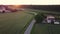 SUV traveling on road through barley crop field. FHD footage