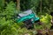 SUV in the tropical jungle - March 7, 2013 Adventure car enthusiast wading a rocky river using modified four wheel car