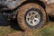 SUV wheel stalled in mud and water