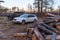 SUVs in a forest glade near the sawn trees