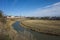 Suzdal view with river Kamenka, Saint Euthymius monastery red wall with towers, residential area and central Russia