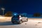 Suzuki swift car on a night winter snowy road