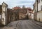 Sv Ignoto street with old brick wall and houses