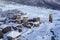 Svan towers in Ushguli view from above, bird view of ancient buildings in snow, Svaneti, Georgia