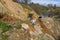 Svaneti, Georgia - 05 May, 2021: The tractor clears the road from a landslide