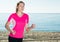 Svelte woman jogging on beach