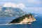 The Sveti Nikola or St. Nicolas island is in Budva riviera with white sand beach and church. The Adriatic sea. Montenegro