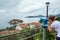 Sveti Stefan island and the Adriatic sea in panorama from coin operated binoculars in hill of town. Montenegro, Europe