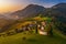 Sveti Tomaz, Slovenia - Aerial drone view of Sveti Tomaz Saint Thomas church at sunset in Skofja Loka area