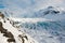 Svinafellsjokull glacier tongue in winter, blue ice covered by snow, Iceland