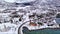 Svolvaer city Norway winter aerial 4k video over Lofoten Archipelago , fjord covered in snow on the mountains on polar circle