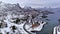 Svolvaer city Norway winter aerial 4k video over Lofoten Archipelago , fjord covered in snow on the mountains on polar circle