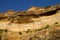 Swallow nests in the sandstone cliff