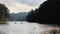 swan swimming and Silhouette group of tourists are rafting in morning sunlight at reservoir Pang Ung landmark mea hong son