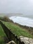 Swanage, Dorset / England: A beautiful cliff view across the Pines hotel lawn at Swanage Bay, towards hills & cliffs