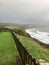 Swanage, Dorset / England: A beautiful cliff view across the Pines hotel lawn at Swanage Bay, towards hills & cliffs