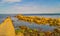 At Swanage Dorset a narrow path stretches out to a blue horizon, an empty walkway into the sea.