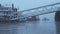 Swans in empty, deserted Central London on the River Thames on a cool blue misty morning on day one