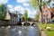 Swans in lake of love in Bruges, channel panoramic view near Begijnhof