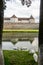 Swans at the moat around medieval Fagaras Citadel. FÄƒgÄƒraÈ™, BraÈ™ov County, Transylvania, Romania