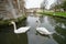 Swans on moat at historic building