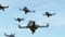 Swarm of security drones with search light flying in the sky