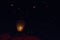 Swarms paper lanterns flying in the beautiful dark sky.