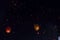 Swarms paper lanterns flying in the beautiful dark sky.