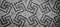 Swastika symbol in ancient Celtic mosaic decoration. Design for an old style background