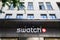 Swatch logo on the main store of the brand in Geneva. Swatch is one of the most famous watch manufacturers in Switzerland