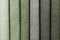 Swatch of woven textile shade of green colors, background