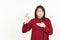 Swearing or Promise Gesture Of Beautiful Asian Woman Wearing Red Shirt Isolated On White