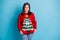 This sweater is disgusting. Photo portrait of displeased brunette pulling holding sweater with hands wearing jumper tree