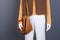 Sweater, waistcoat, handbag on female mannequin.