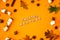 SWEATER WEATHER text . Cinnamon marshmallows leaves and anise on yellow background. Fall composition. Ornament For Thanksgiving.