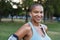 Sweating woman resting after jogging