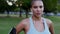 Sweating woman resting after jogging