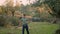 Sweaty farmer walking garden nature closeup. Man holding rake harvest olives