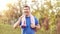 Sweaty mature jogger man drinking water after jogging