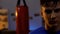 Sweaty teenager looks seriously after intensive boxing workout, facing challenge