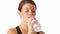 Sweaty woman drinking water after a workout