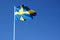 Sweden flag waving against the clear blue sky