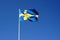 Sweden flag waving against the clear blue sky